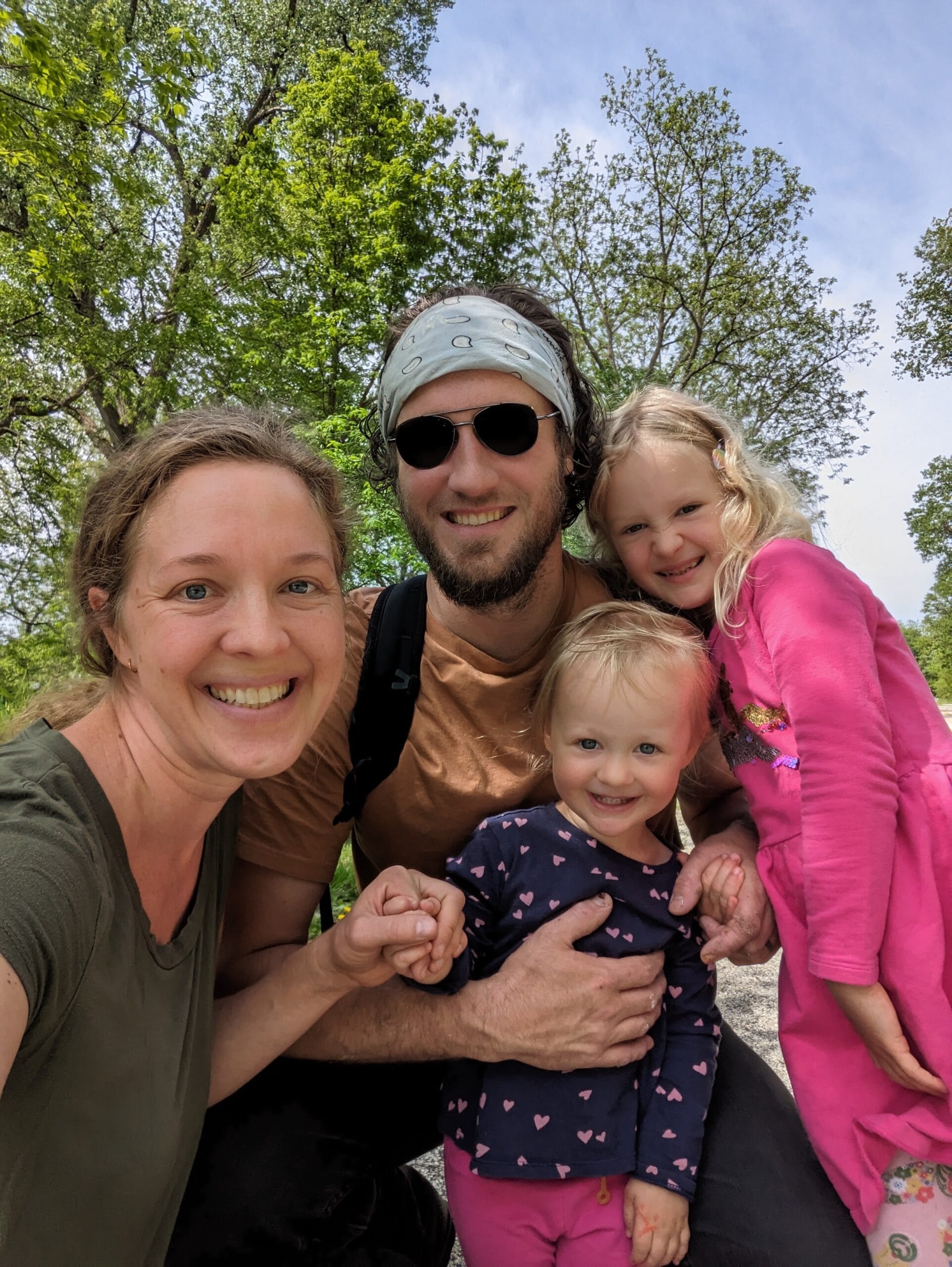 a caucasian family of 4 posing in front of some trees, the family in About Maxon Made