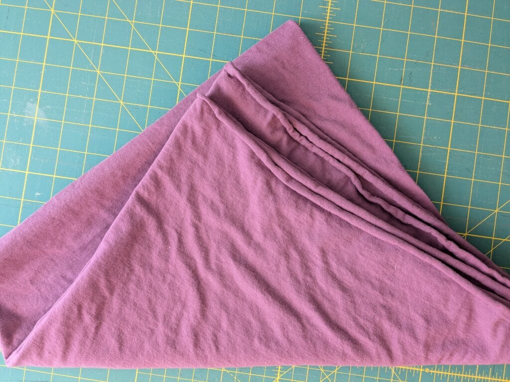 berry colored knit fabric ready to cut into hankies without using a sewing machine.