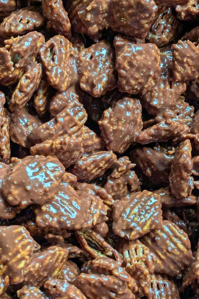 puppy chow fully coated in a doubled dark chocolate coating