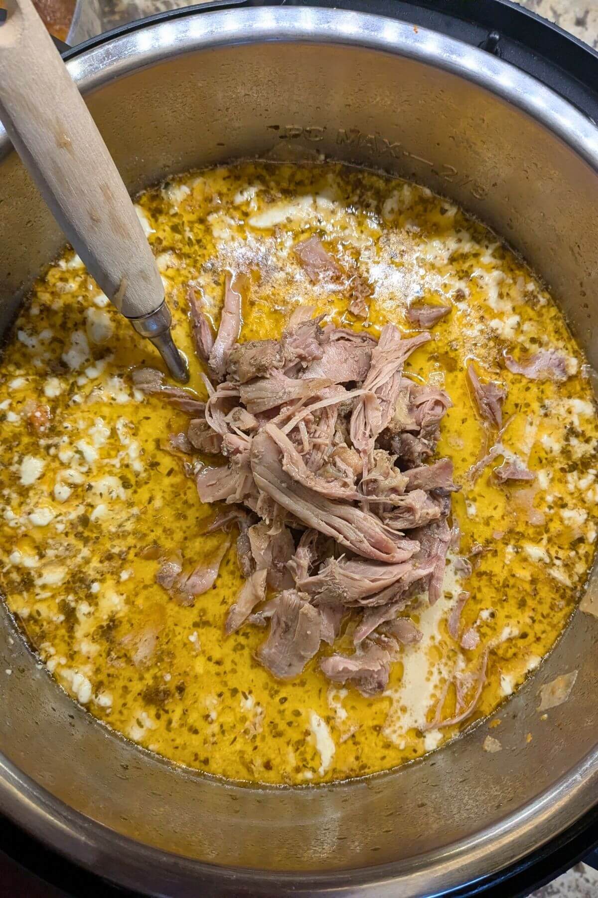 Chicken added back into the Easy white chicken chili in the crock-pot or instant pot.