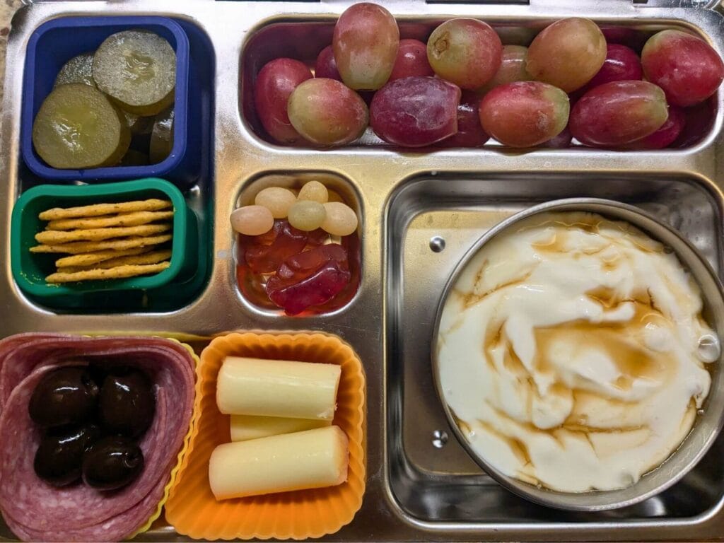 how to pack a balanced kids lunch with fruit and veggies and leak proof containers in a tray style compartment lunch box