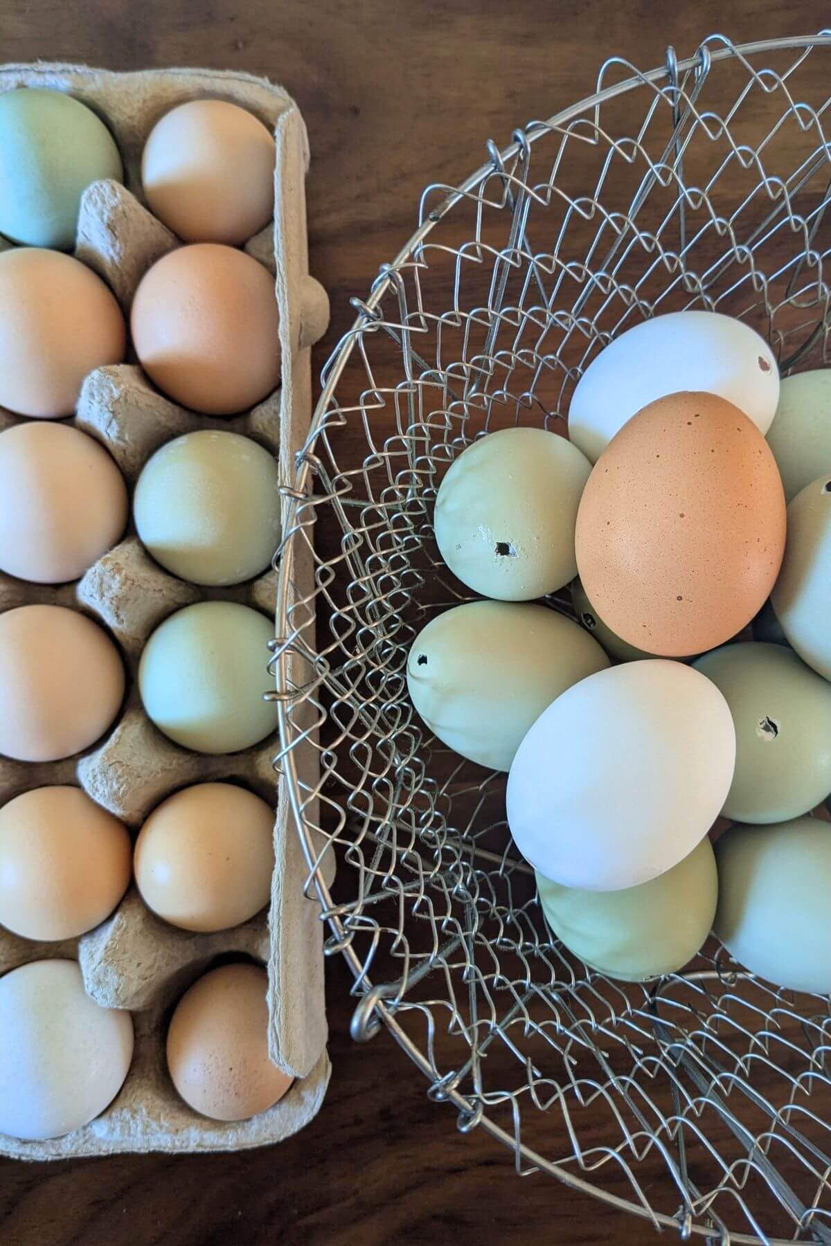 Many natural colored eggs in a basket and carton