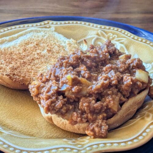 Savory tavern-style sloppy Joe sandwich made with frozen ground beef steaming hot on a bun.