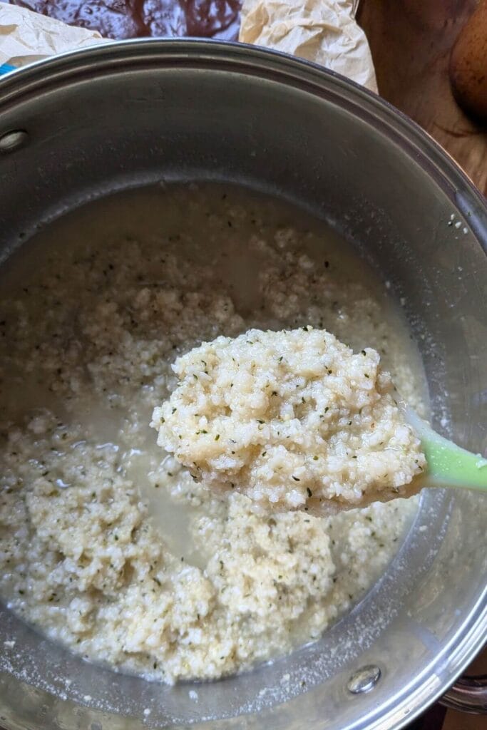 Mixing no bake coconut bar mixture evenly before spreading and chilling in the pan