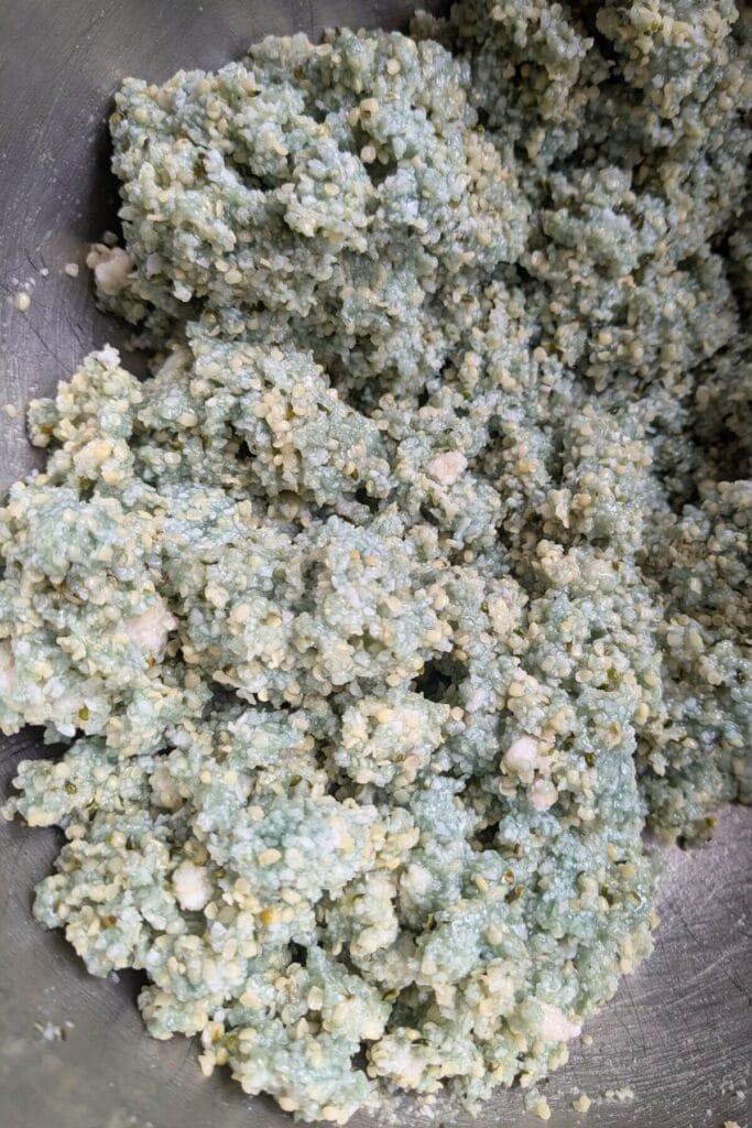 Mixing ingredients for no bake chocolate coconut bars in a bowl