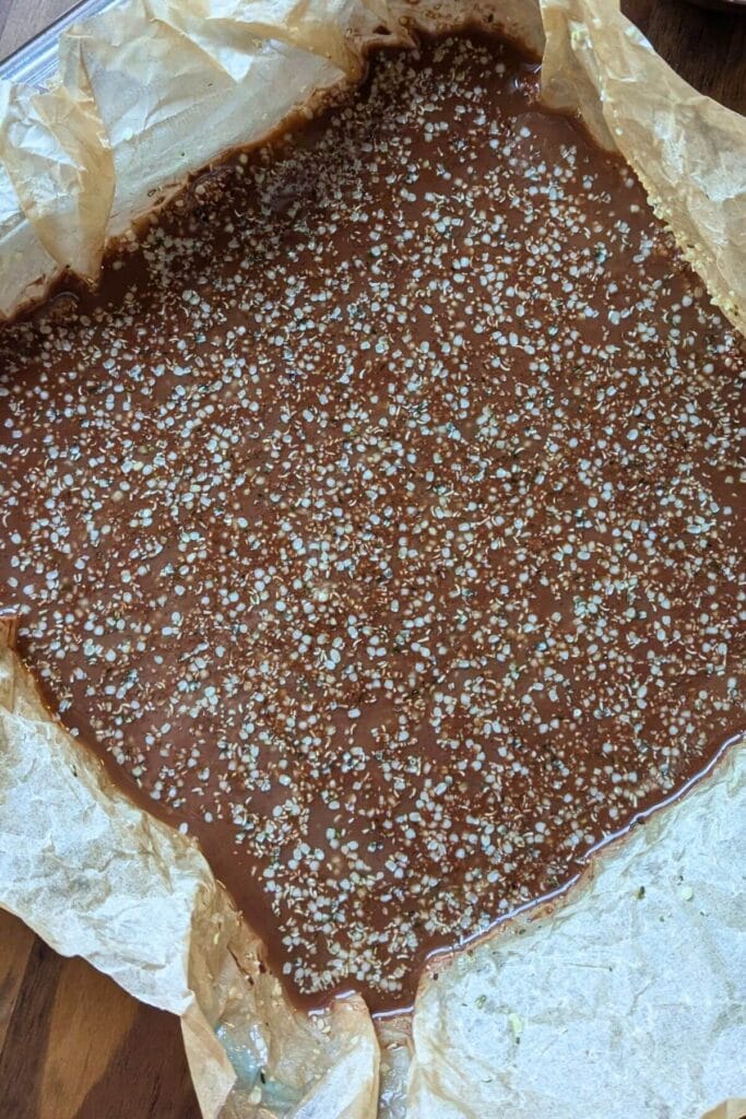 Layered chocolate and mint coconut bars before slicing