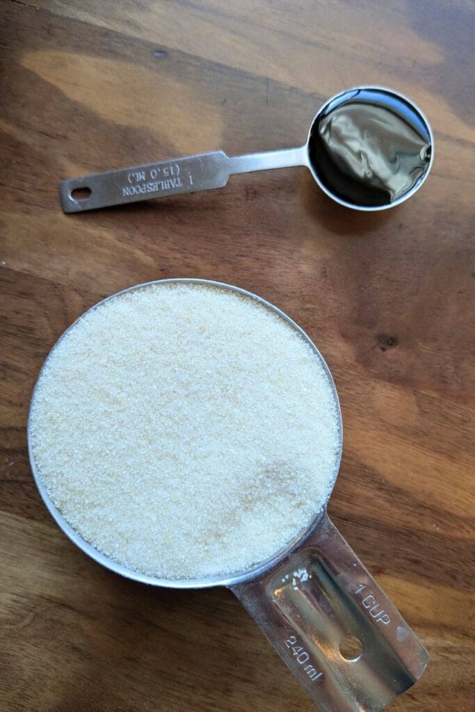 Granulated white sugar and molasses used to make homemade brown sugar.