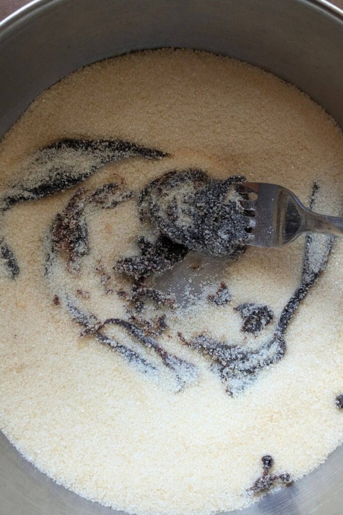 Granulated sugar and molasses being mixed together.