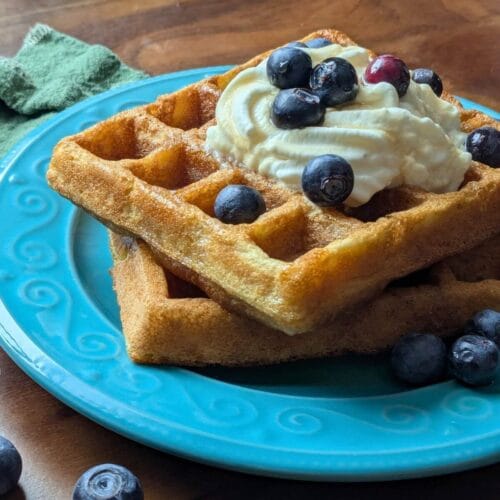 Stack of golden sourdough waffles made with almond and coconut flour