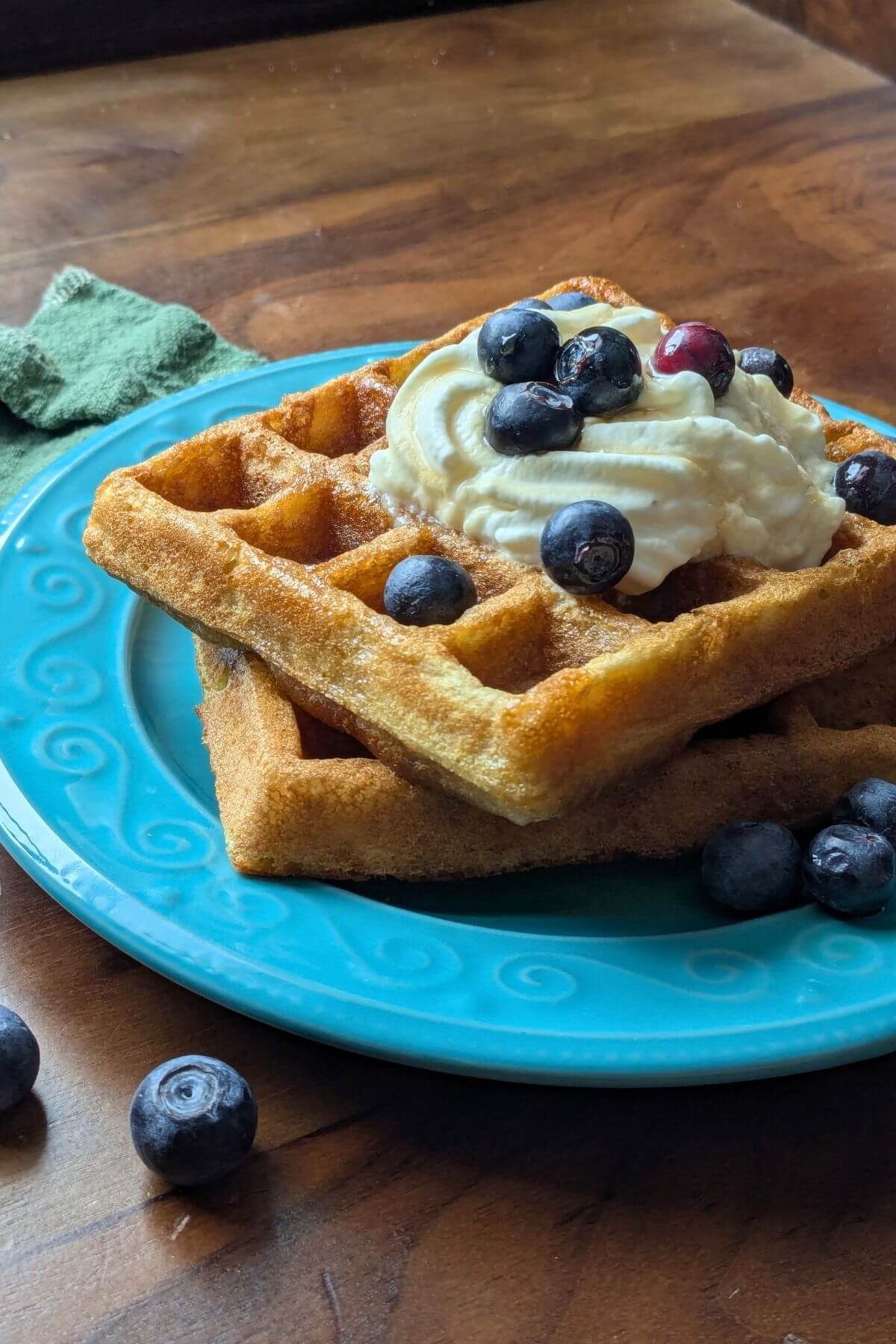 Stack of golden sourdough waffles made with almond and coconut flour